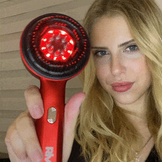 Vibrating hairbrush with scalp care oil
